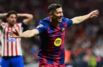 Barcelona beats 10 man Atletico Madrid to widen lead atop La Liga standings