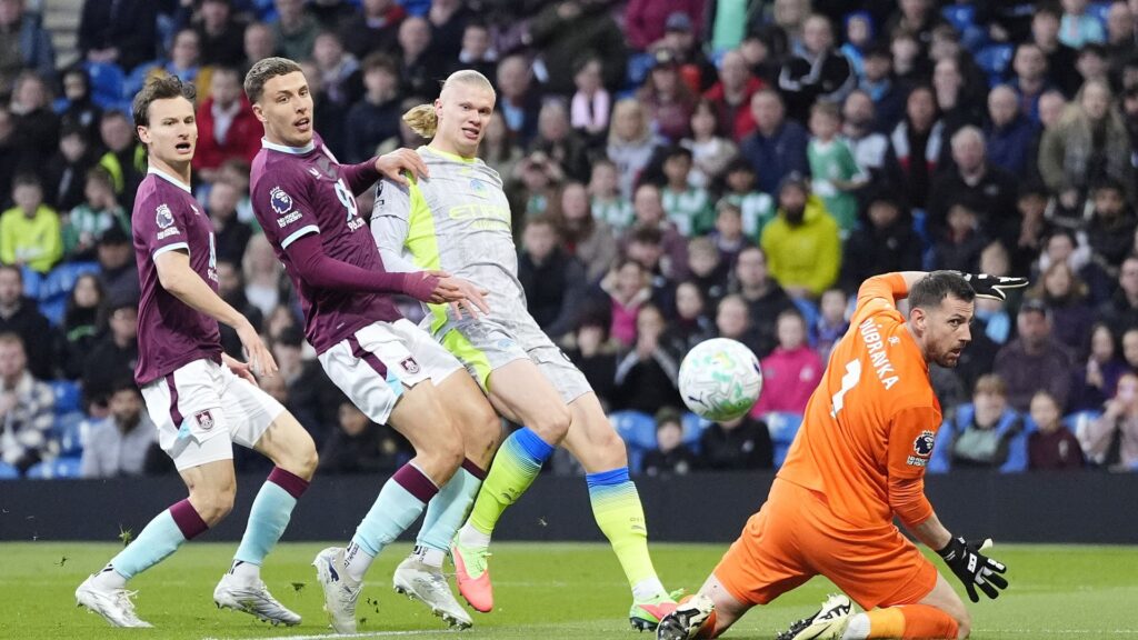 Man City struggle but go top of the Premier League and relegate Burnley