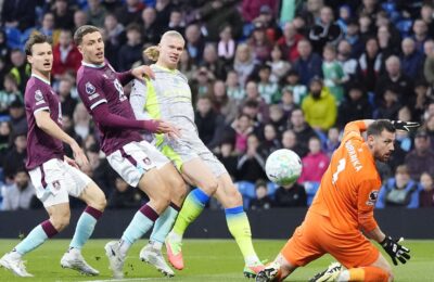 Man City struggle but go top of the Premier League and relegate Burnley