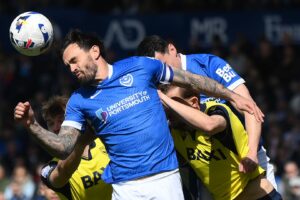 Ten-man Pompey hit back to hold Oxford in relegation thriller